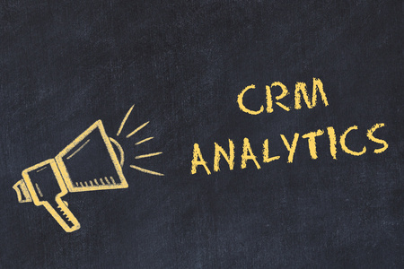 Chalk board sketch with handwritten text crm analytics.の写真素材