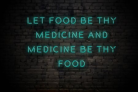 Neon inscription of positive wise motivational quote against brick wall .の写真素材