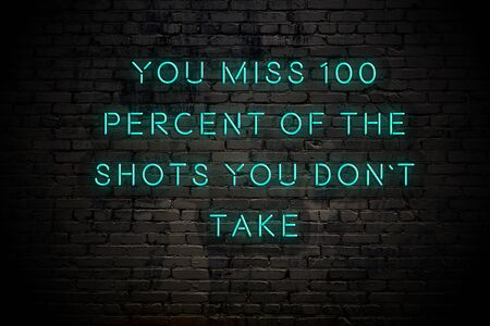 Neon inscription of positive wise motivational quote against brick wall .の写真素材