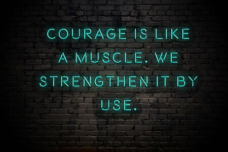 Neon inscription of positive wise motivational quote against brick wall .の写真素材