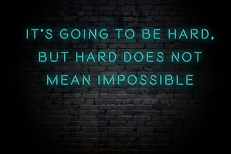 Neon inscription of positive wise motivational quote against brick wall .の写真素材