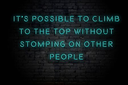 Neon inscription of positive wise motivational quote against brick wall .の写真素材