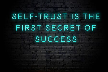 Neon inscription of positive wise motivational quote against brick wall .の写真素材