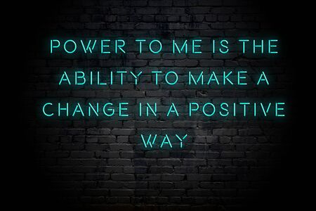 Neon inscription of positive wise motivational quote against brick wall .の写真素材