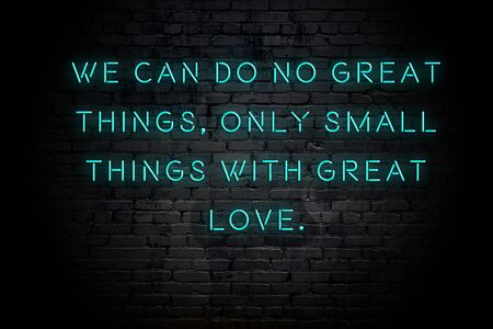 Neon inscription of positive wise motivational quote against brick wall .の写真素材