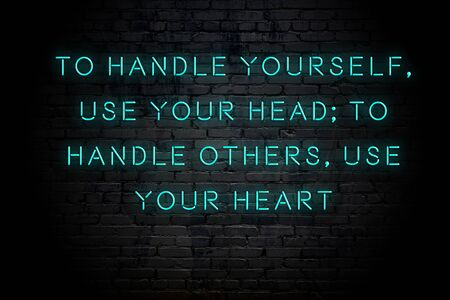 Neon inscription of positive wise motivational quote against brick wall .の写真素材