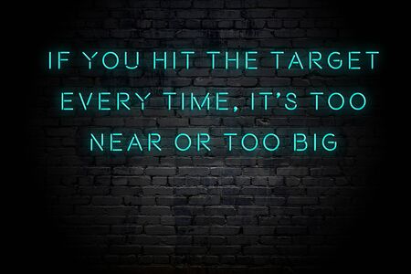 Neon inscription of positive wise motivational quote against brick wall .の写真素材