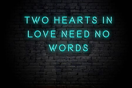 Neon inscription of positive wise motivational quote against brick wall .の写真素材