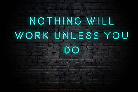 Neon inscription of positive wise motivational quote against brick wall .の写真素材