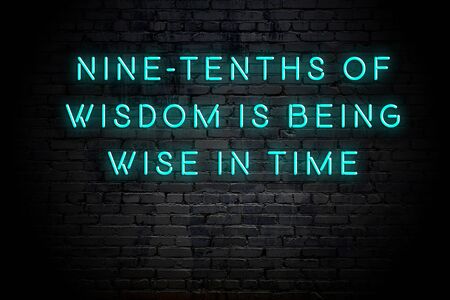 Neon inscription of positive wise motivational quote against brick wall .の写真素材