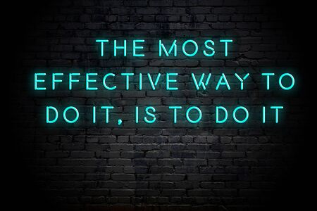 Neon inscription of positive wise motivational quote against brick wall .の写真素材