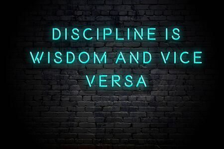 Neon inscription of positive wise motivational quote against brick wall .の写真素材