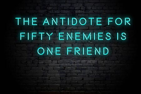 Neon inscription of positive wise motivational quote against brick wall .の写真素材