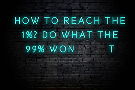 Neon inscription of positive wise motivational quote against brick wall .の写真素材