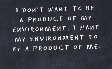 Black chalkboard with handwritten wise motivational quote .の写真素材