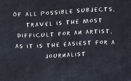 Black chalkboard with handwritten wise motivational quote .の写真素材