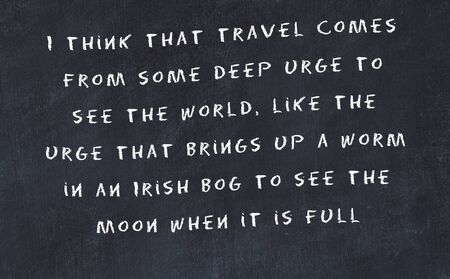 Black chalkboard with handwritten wise motivational quote .の写真素材