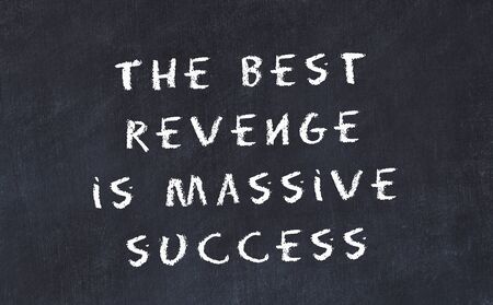 Black chalkboard with handwritten wise motivational quote .の写真素材