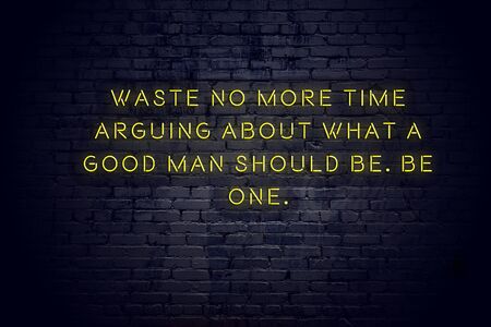 Neon sign with positive wise motivational quote against brick wall .の写真素材