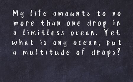 Chalk handwritten inscription of smart quotation on black chackboard
