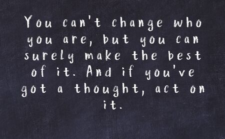 Smart saying handwritten with chalk on black desk