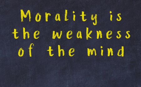 Chalk handwritten inscription of smart quotation on black chackboardの写真素材