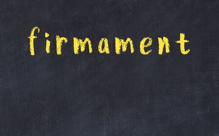 Chalk handwritten inscription firmament on black deskの写真素材