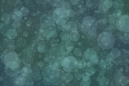 Dark green bokeh background, circle shaped defocused spots.