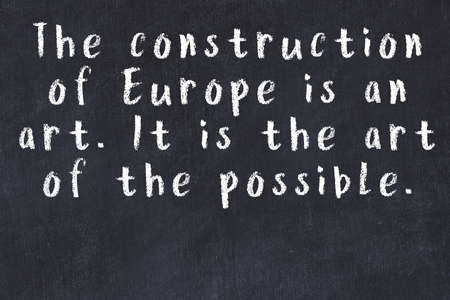 Smart saying handwritten with chalk on black deskの写真素材