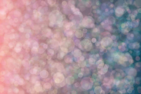 Beautiful harmonic mysterious backgeound with dark blue and green and pink colored bokeh.の写真素材