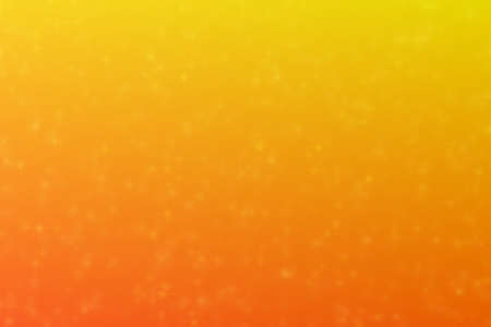 orange and yellow abstract defocused background with star shape bokeh spots
