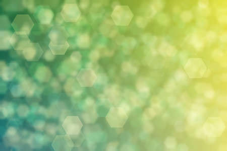 yellow-green and green abstract defocused background, hexagon shape bokeh pattern.の写真素材