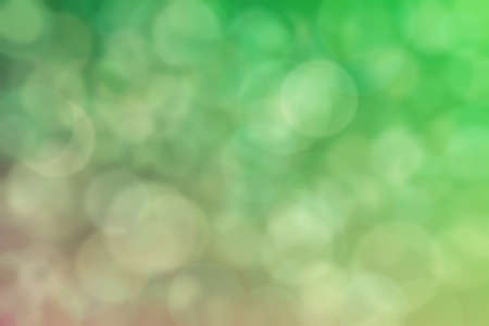 olive and green abstract defocused background with circle shape bokeh spotsの写真素材