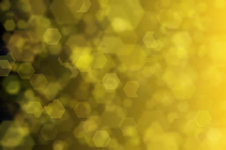yellow and black abstract defocused background with hexagon shape bokeh spots