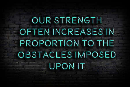 Smart and motivational quotation. Neon sign on brick wall in the darknessの写真素材