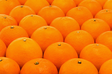Background of fresh, juicy, bright mandarinsの写真素材