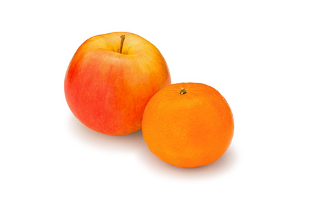 Fresh, juicy, bright apple and mandarin on a white backgroundの写真素材