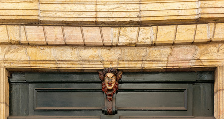 Satire mask over the house door. Burgundy, Franceの写真素材
