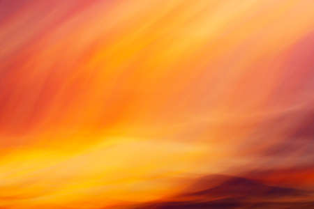 Flaming mystic colors sunset clouds shooted with camera motion as creative abstract background