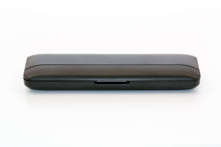 Closed black plastic protective case for artist or designer accessories on white background....