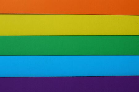 Multi-colored cardboard of five colors, background. Orange, yellow, blue, violet colors. Conceptual and symbolic background.の写真素材