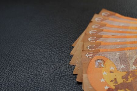 Euro lined with fan on black leather texture luxury background