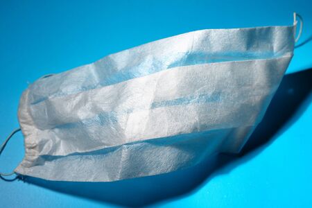 Medical mask on a classic blue background