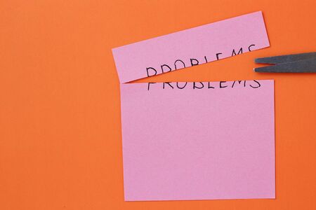 The inscription on the sticker: Problems on an orange backgroundの写真素材