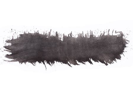 Trace of black paint from a brush on a white background, isolated. Graphic resource, substrate, blank for design, abstract space for text.の写真素材