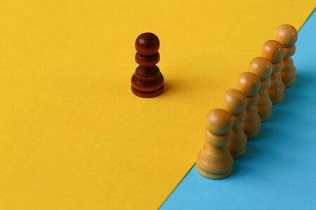 Abstract art concept of an ideological leader and organizer of management based on chess pawns