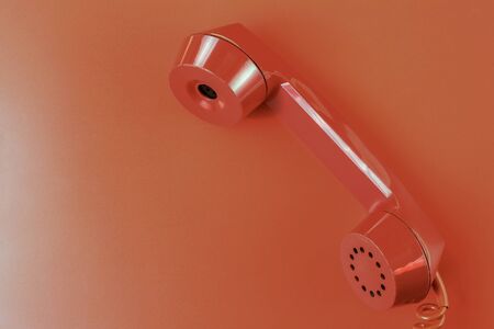 Old vintage red handset, creative symbolic abstract background