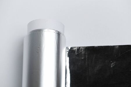 Aluminum foil for baking on a light backgroundの写真素材