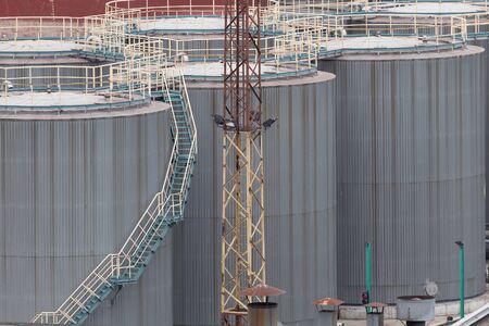 Huge storage of oil, large metal tanks with fuel. Backgroundの写真素材