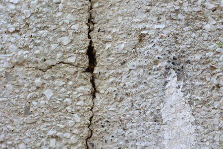 Large crack in the wall of the house, background